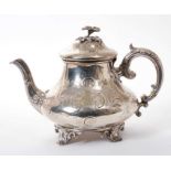 Victorian silver teapot with engraved foliate scroll decoration