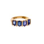 Sapphire four stone ring with four oval mixed cut blue sapphires measuring approximately 6.5-6.7mm x