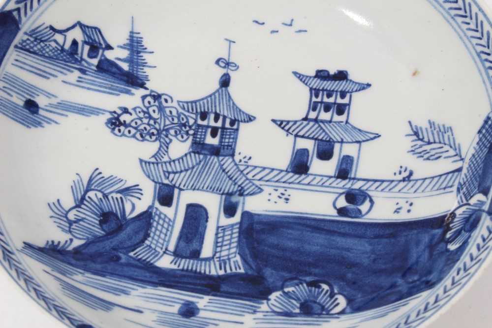 Two similar Lowestoft blue and white saucers, c.1790, painted with Oriental pagoda patterns, ex. Kit - Image 2 of 4