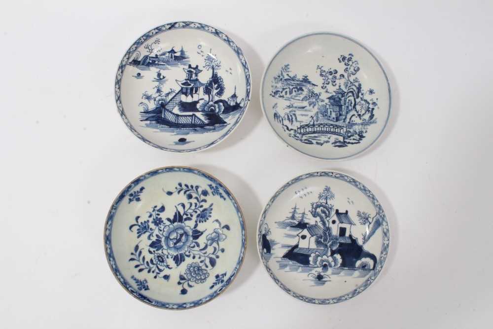 Four 18th century Lowestoft blue and white porcelain saucers, three of which are painted and one pri