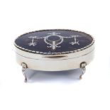 Edwardian silver box of oval form with blue velvet lining.