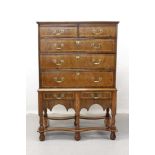 18th century and later walnut chest on stand with two short and three long graduated drawers and two