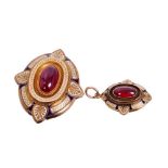 Victorian Etruscan revival gold enamel and cabochon garnet pendant brooch, the central oval cabochon