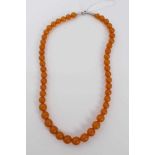 Amber bead necklace with a string of graduated spherical beads measuring approximately 10mm to 8mm d