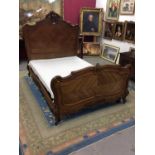 French carved walnut double bed, with purpose built metal frame