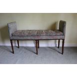 Unusual George III mahogany window seat of unusual gently trapezoidal form, on turned legs.