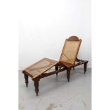 Late Victorian officers folding mahogany framed campaign bed with caned base and adjustable back on