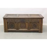 Small 17th century carved oak coffer with Regency lining paper to interior 108cm wide, 47cm deep, 44