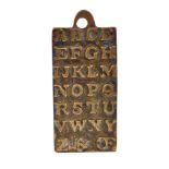 Rare child's brass alphabet plaque signed St Paul's 1729