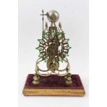 Victorian brass gothic skeleton clock with single fusee movement striking on bell on giltwood and ve