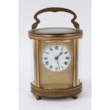 Antique oval carriage clock with circular dial