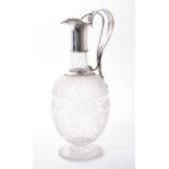 Victorian cut glass claret jug of bulbous form, with etched floral decoration and star cut base, flo