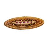 Victorian oval brooch with rubies and diamonds