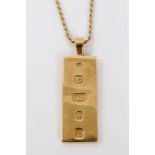 18ct gold ingot pendant on an 18ct gold rope twist chain