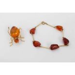 Amber spider brooch and an amber bracelet