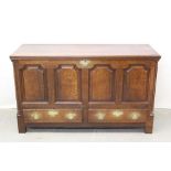 18th century oak panelled mule chest with turned pilasters ,two drawers on bracket feet. 143cm wide,