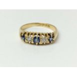 Edwardian five stone diamond and sapphire ring in claw setting on 18ct gold shank