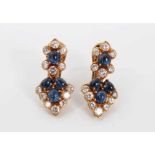Pair of sapphire and diamond pendant earrings with cabochon blue sapphires and brilliant cut diamond