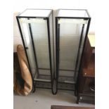 Three black metal framed glass display cabinets with glass shelves, 45 x 180.5 x 40cm