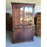 19th century mahogany two height bookcase with two glazed doors above enclosing four adjustable shel