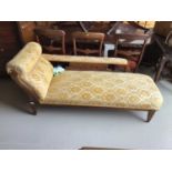 Late Victorian walnut framed chaise lounge upholstered in a gold patterned material H74cm W170cm D63