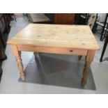 Contemporary pine kitchen table on turned legs H77cm W119cm D89cm