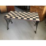 Cast iron garden table with chequered tiled top