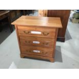 Edwardian satinwood chest of three drawers with swan neck handles on bracket feet H83cm W83cm D51cm