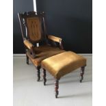 Edwardian mahogany carved low easy chair together with a matching stool H104cm W61.5cm D60cm