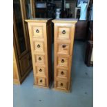 Pair of stained pine narrow chests with five drawers and metal looped handles H120cm W33cm D30cm