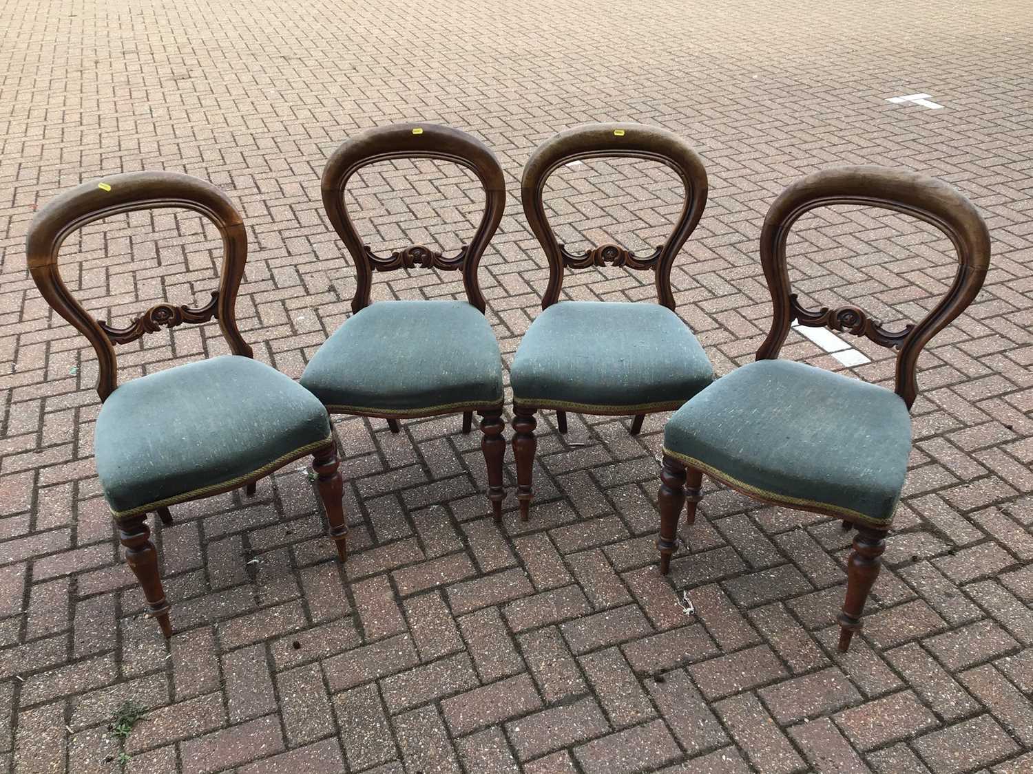 Set of four Victorian mahogany balloon back dining chairs upholstered in blue material on turned