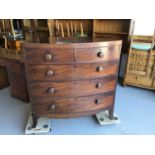 George III mahogany bow front chest of two short and three long drawers with turned handles on brac