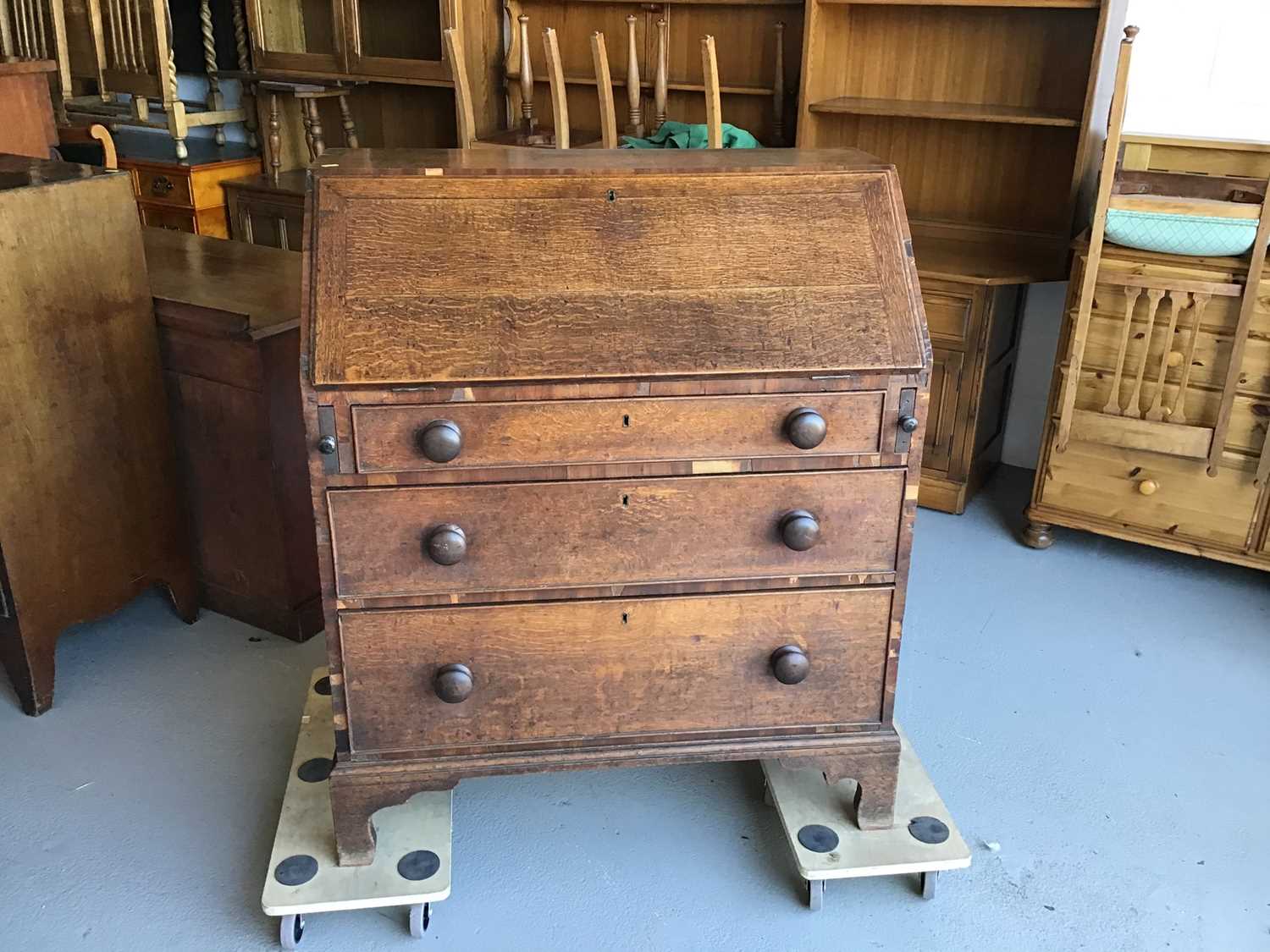 19th century oak bureau with fitted interior above three drawers on bracket feet H106.5cm W90cm D48.