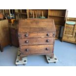 19th century oak bureau with fitted interior above three drawers on bracket feet H106.5cm W90cm D48.