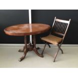 Victorian mahogany loo table with oval inlaid top on turned carved base together with an antique