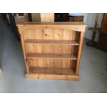 Pine open bookcase and a pine cupboard with two drawers