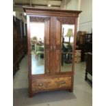 Late Victorian carved walnut double wardrobe with two mirrored doors and single drawer below