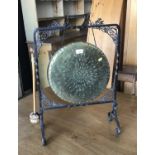 Old brass gong in wrought iron stand