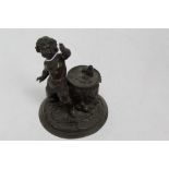 Unusual Bronze novelty inkwell with putti mount