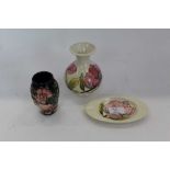 Moorcroft pottery vase decorated with a pink flower on cream ground, similar ashtray and one other M