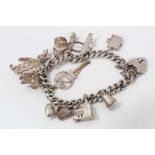 Silver charm bracelet with thirteen charms