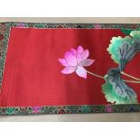 Large Chinese embroidered red silk wall hanging. Polychrome silk thread embroidered lotus flowers, w