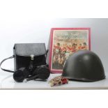 Eastern German Military helmet dated 1961, together with a rifle cleaning kit and binoculars in fitt