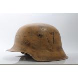 Second World War Nazi Wehrmacht M40 Pattern steel helmet, in camouflage painted finish, believed to