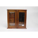 Edwardian glass fronted wooden smokers cabinet with inlaid decoration, 34cm across