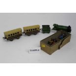 Railway Mettoy tin plate train in box together with lead soldiers