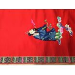 Large Chinese embroidered red silk wall hanging. Polychrome silk thread embroidered male and female