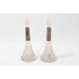 Pair of cut glass scent bottles with silver mounts (Birmingham 1915)