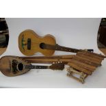 Collection of four instruments to include an Appalachian three string dulcimer, a square neck slide