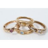 Four 9ct gold gem set rings